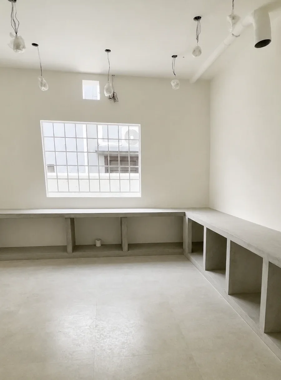 Same room after painting — smooth off-white walls and finished counters